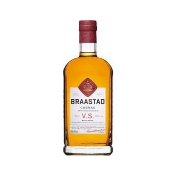 Braastad VS Cognac bottle with amber liquid and red label on green background