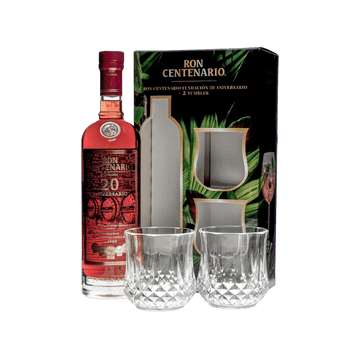 Ron Centenario 20 Aniversario rum bottle with two clear crystal tumblers and branded black packaging