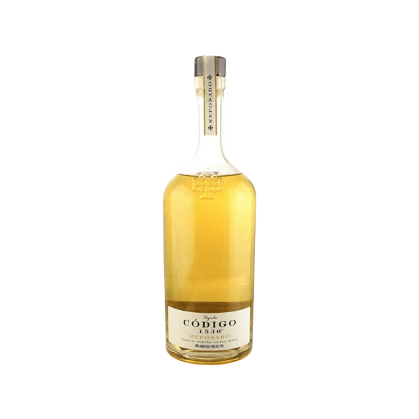 Bottle of Código 1530 Reposado tequila with golden amber liquid and beige label