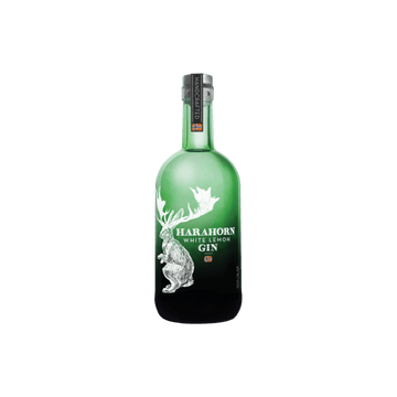 Green bottle of Harahorn White Lemon Gin with white stag design and handcrafted label