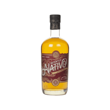 Auténtico Nativo aged rum bottle with amber liquid and red decorative label