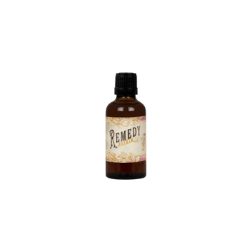 Remedy bitters bottle with vintage label on green background, premium beverage ingredient