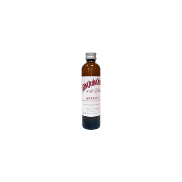Small bottle of Rinquinquin apéritif with a silver cap on a plain background
