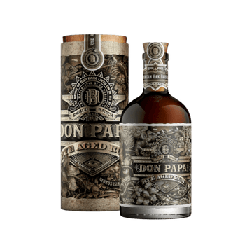 Bottle and packaging of Don Papa Rye Aged Rum with vintage botanical design and dark amber liquid