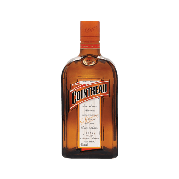Cointreau orange liqueur bottle with clear label on white background