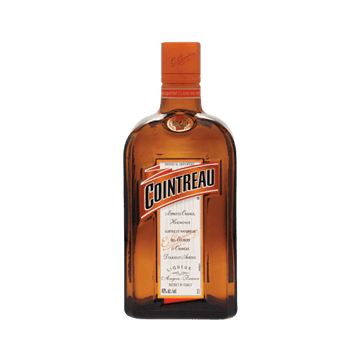 Cointreau orange liqueur bottle with clear label on white background