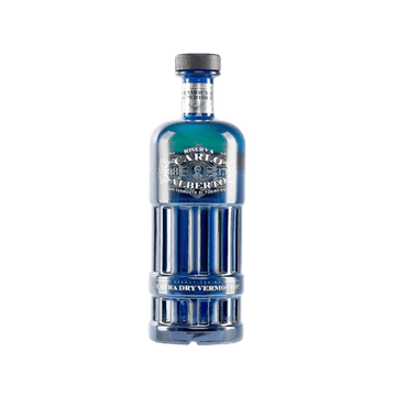 Blue glass bottle of premium extra dry vermouth with silver label